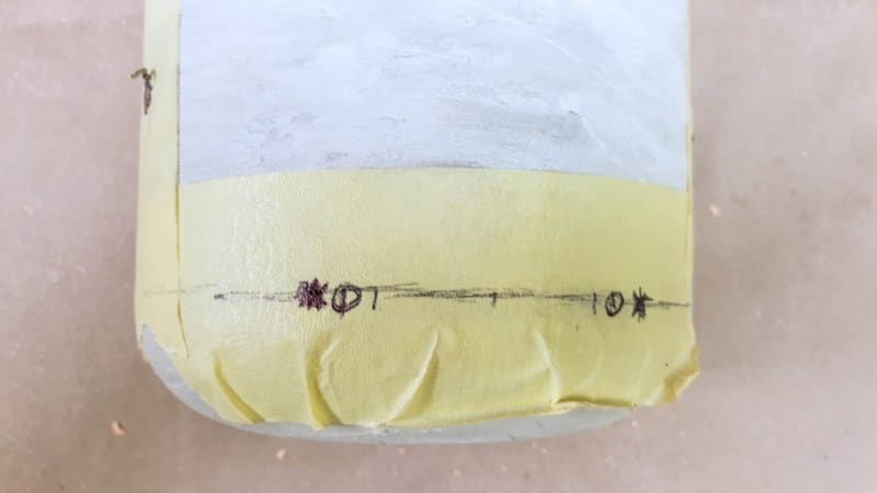 Use masking tape to protect the planters while drilling