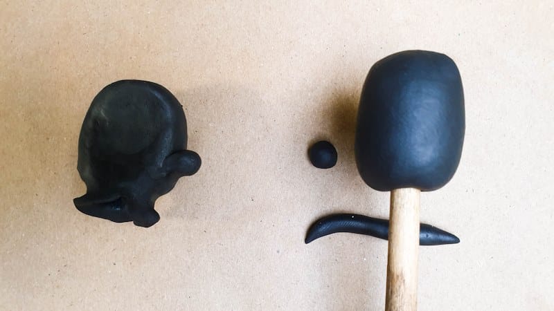 Use a paintbrush to make a hole in the bottom of the cartoon hands