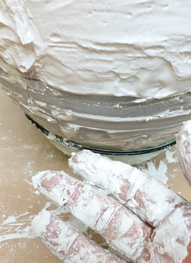 Apply the casting stone with your hands to get a rough natural texture
