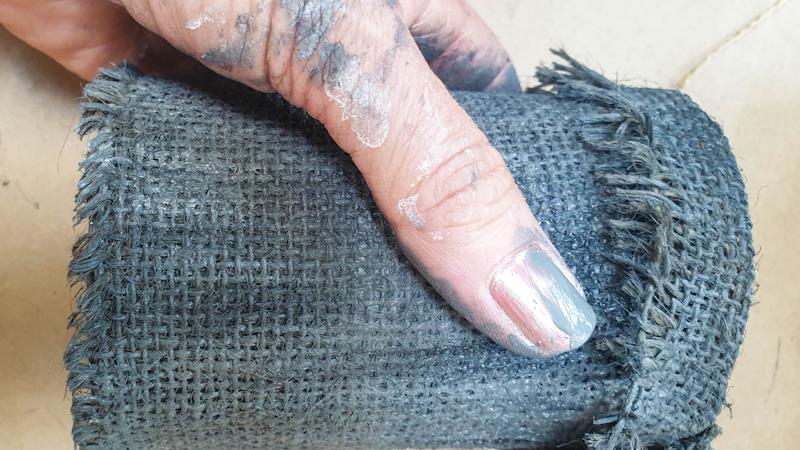 A view of the burlap covered tin can after painting