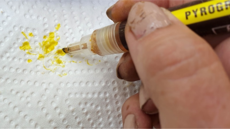 Dab the pen nib a few times to get the ink chemicals to flow