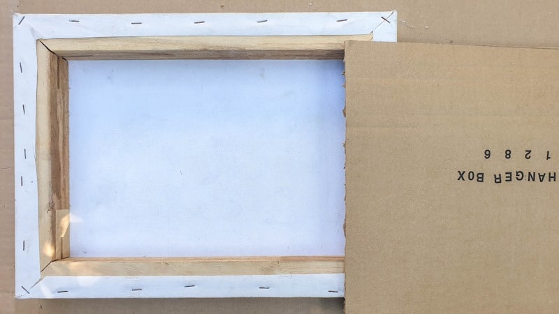 A piece of cardboard will be used to create the back gallery wall