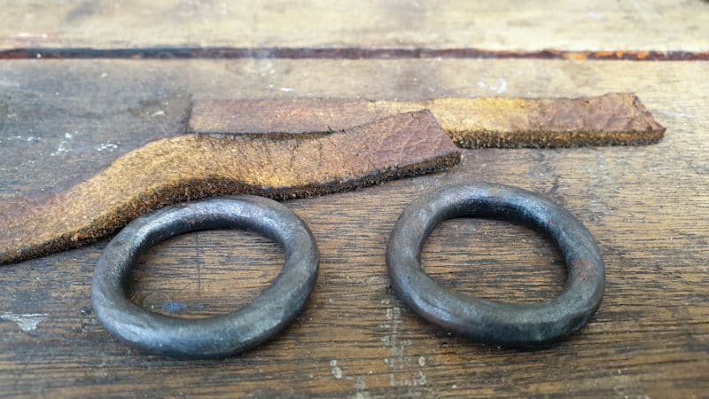 The baked clay rings and leather straps will be used to make door pulls