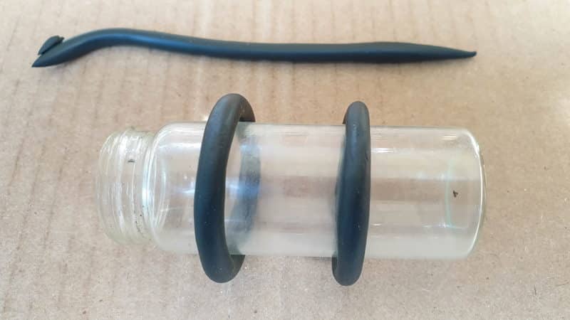 Wrap the clay worms around a bottle to form a ring