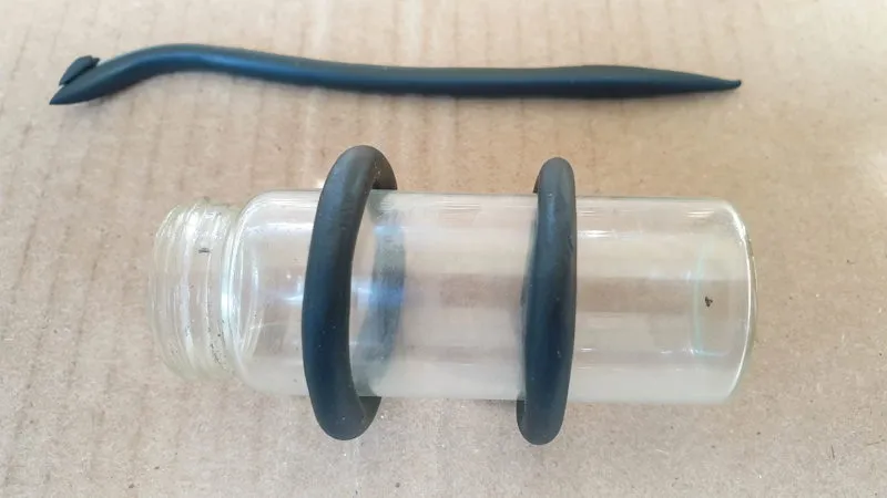 Wrap the clay worms around a bottle to form a ring