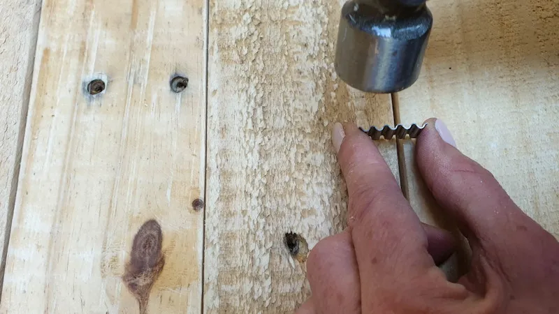 Gently tap the metal joiners with a hammer until they're flush with the top of the wood