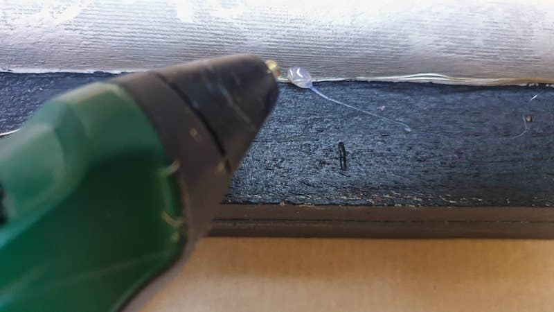 Glue the lights along the inside edge of the canvas