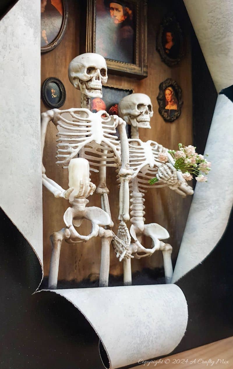 Get your spook on and add a touch of macabre whimsy to your d&eacute;cor with this DIY Halloween RIPped canvas tutorial. It even lights up. We&rsquo;ll show you how to turn a deep canvas into an eerie masterpiece using paint, paste and two loving skeletons. Oh, be warned; we will be cutting, slicing, and mangling things up a little to make this haunting diorama.