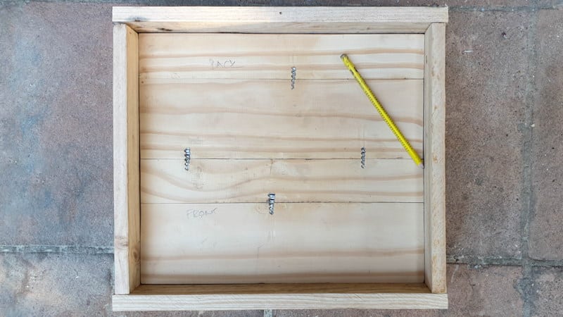Use salvaged wood to make a valance for the bottom of the cabinet