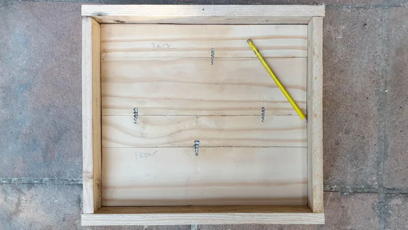 Use salvaged wood to make a valance for the bottom of the cabinet