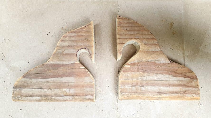 A view of the two scrap wood nuzzling horses after cutting