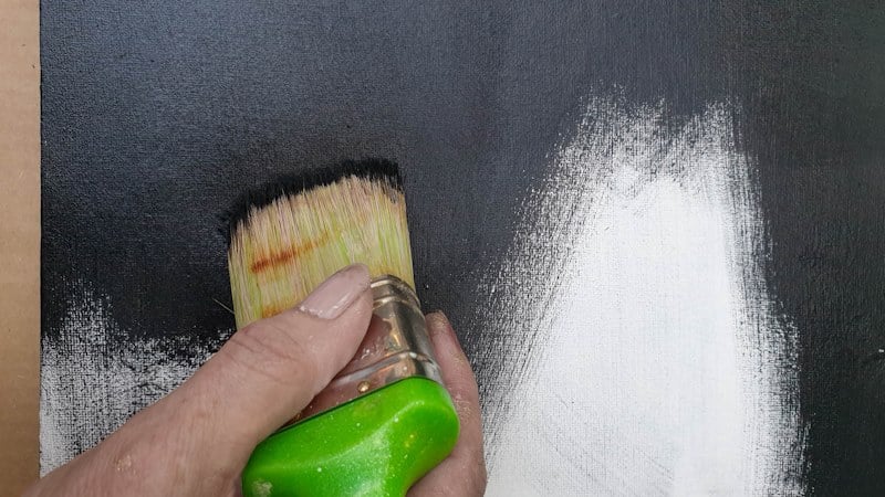 Painting the canvas black to create a sense of drama