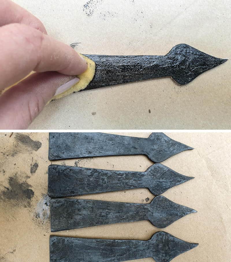 Paint the cardboard hinges in blacks and greys to mimic metal