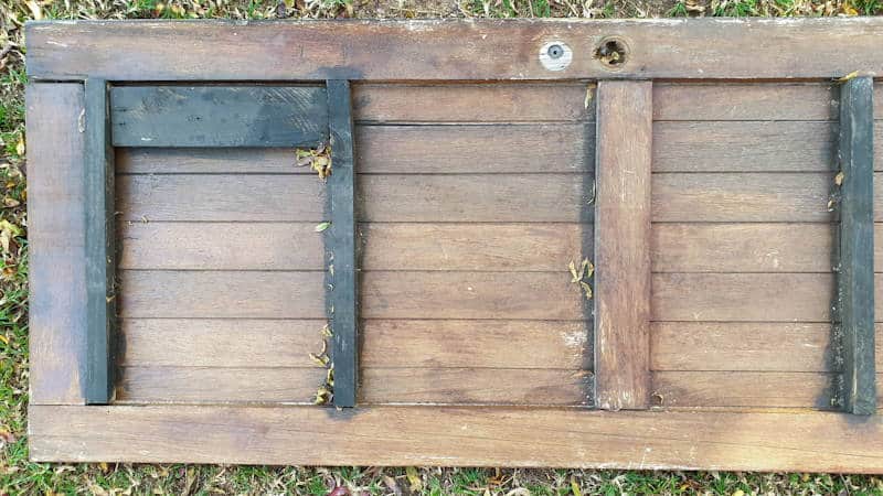 Dismantle an old door to salvage the wood for the cabinet