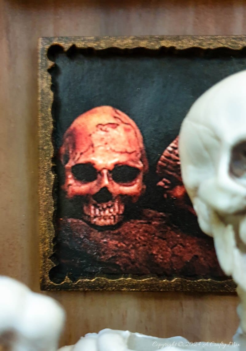 Get your spook on and add a touch of macabre whimsy to your d&eacute;cor with this DIY Halloween RIPped canvas tutorial. It even lights up. We&rsquo;ll show you how to turn a deep canvas into an eerie masterpiece using paint, paste and two loving skeletons. Oh, be warned; we will be cutting, slicing, and mangling things up a little to make this haunting diorama.