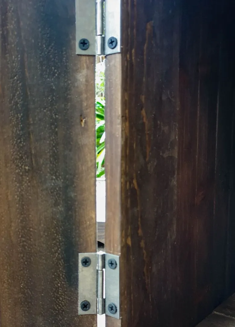 Screw slim hinges to the side of the wooden crate