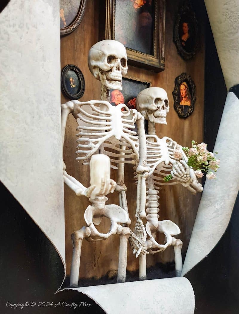 Get your spook on and add a touch of macabre whimsy to your d&eacute;cor with this DIY Halloween RIPped canvas tutorial. It even lights up. We&rsquo;ll show you how to turn a deep canvas into an eerie masterpiece using paint, paste and two loving skeletons. Oh, be warned; we will be cutting, slicing, and mangling things up a little to make this haunting diorama.