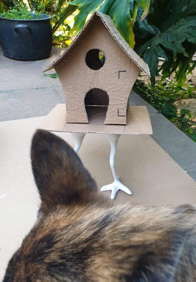 Cuddling a fur baby and watching Baba Yaga's house