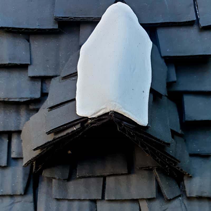 Cover the join between the top shingles with a thin strip of clay