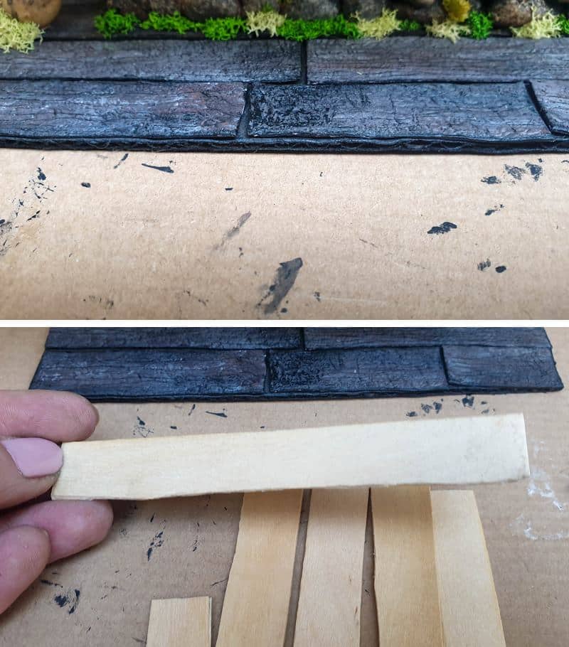 Bulk up the cardboard platform with craft sticks and distress with a wire brush