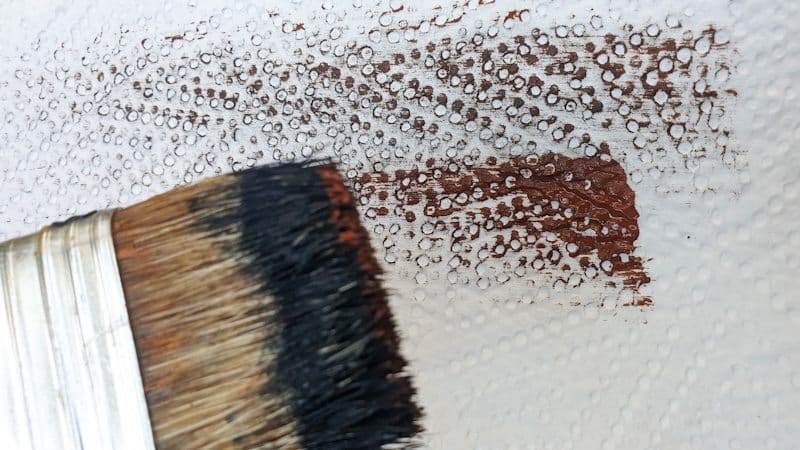 Wipe most of the paint off on a paper kitchen towel