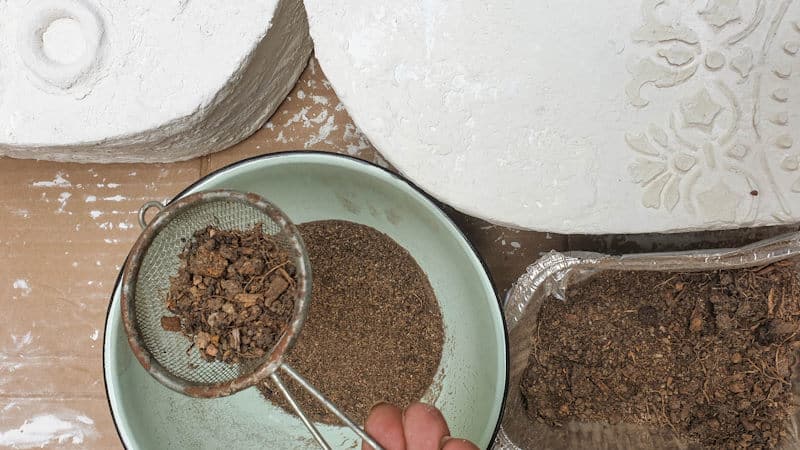 Sift the garden soil to remove any small stones and leaves