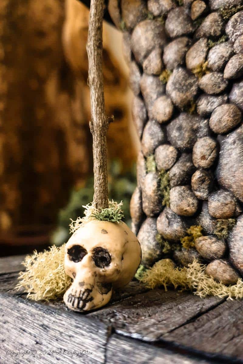 A close up view of the skull and twigs supports on the porch of Baba Yaga's hut
