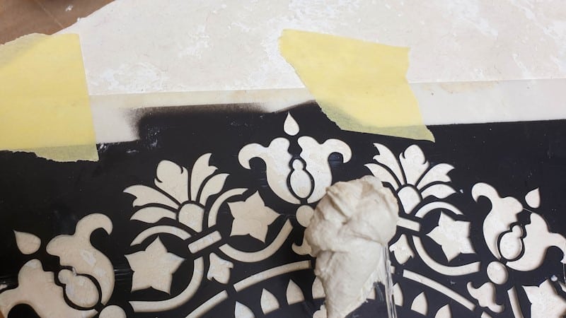 Apply the texture paste over the stencil