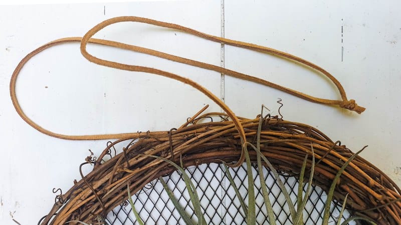 Add a leather cord to hang the wreath