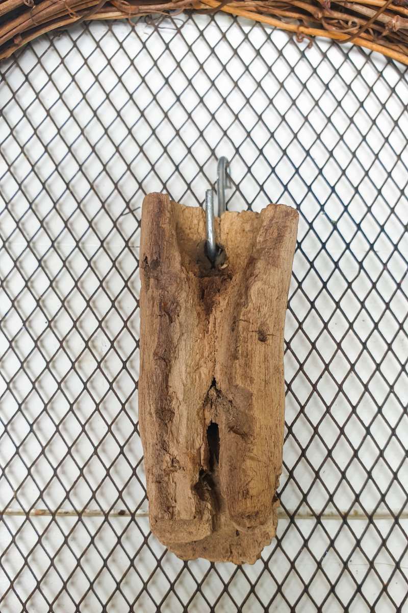 Hanging the driftwood on the wire mesh