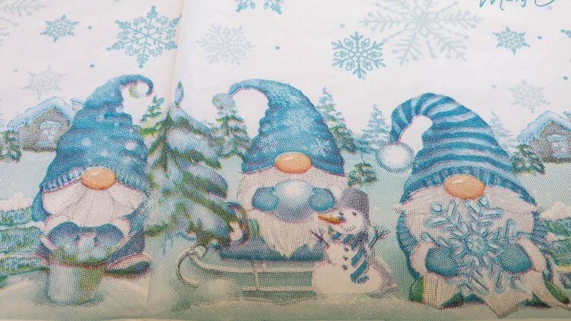 Close up view of the gnomes printed on a paper napkin