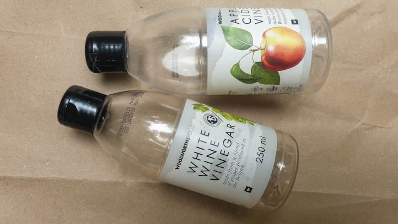 Two empty plastic vinegar bottles