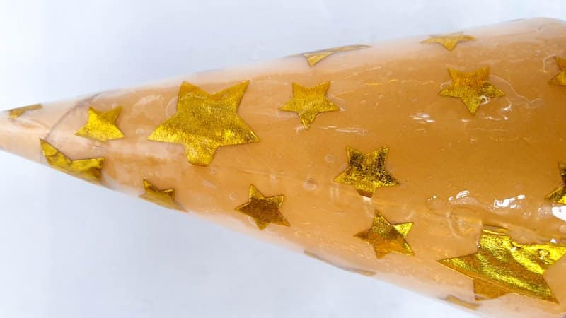 Apply resin all over the paper napkin with a craft stick