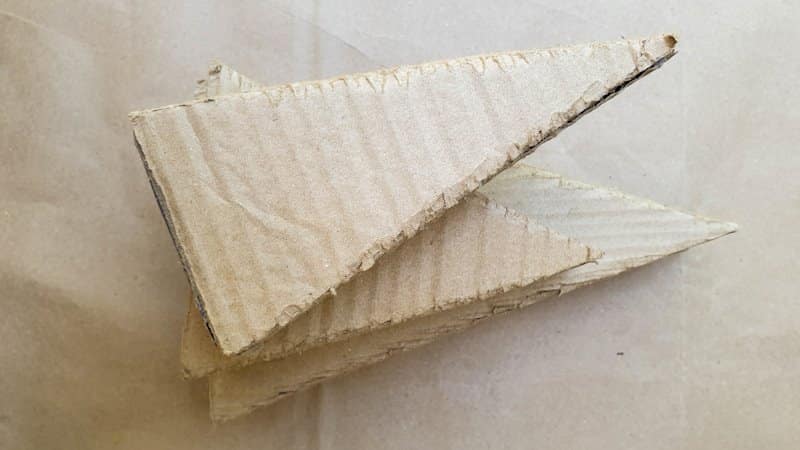 Glue the cardboard pieces together to form a 3D triangle