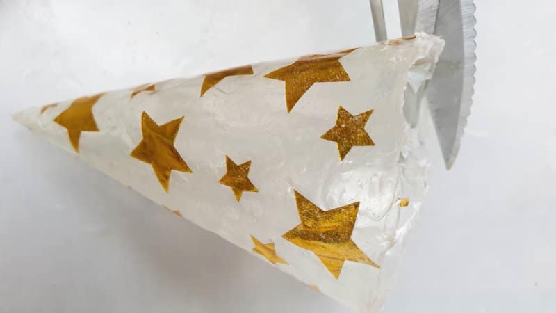 Trim the bottom of the paper napkin tree with a pair of scissors