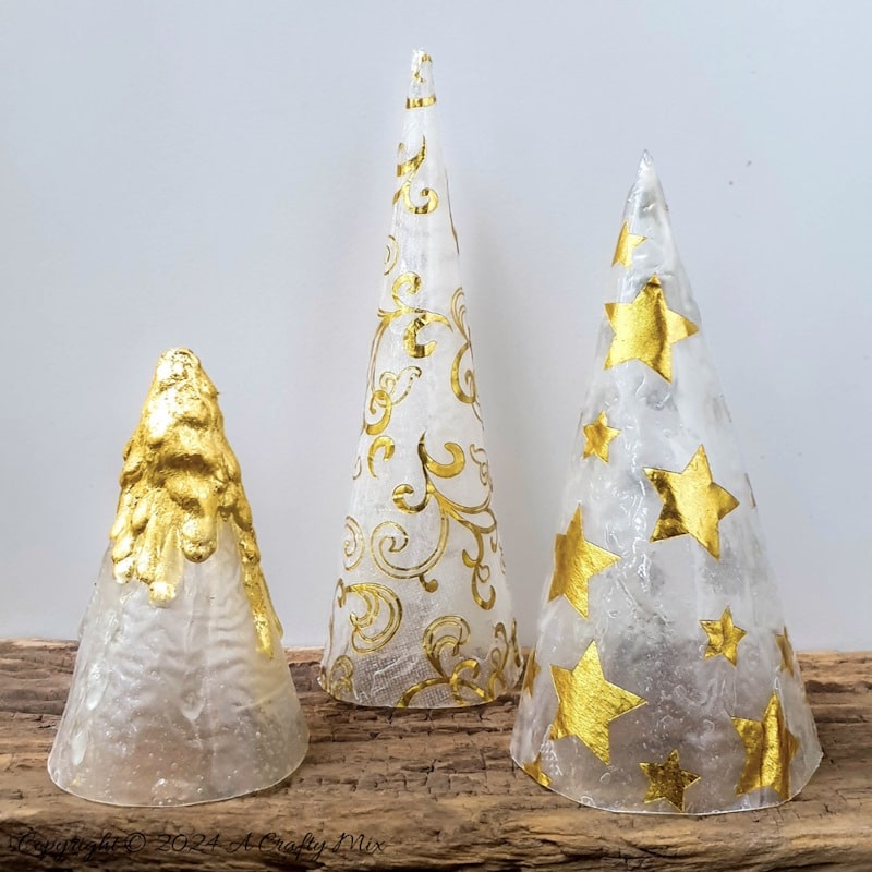 Get ready to add a little sophistication to your decor with these elegant and easy to make tabletop trees that will brighten up any room in your home. Made from paper napkins and filled with fairy lights, these Christmas decorations are perfect for small spaces and look beautiful on a table, mantle or bookshelf. Go glam with hints of gold or use napkins that match your table d&eacute;cor.