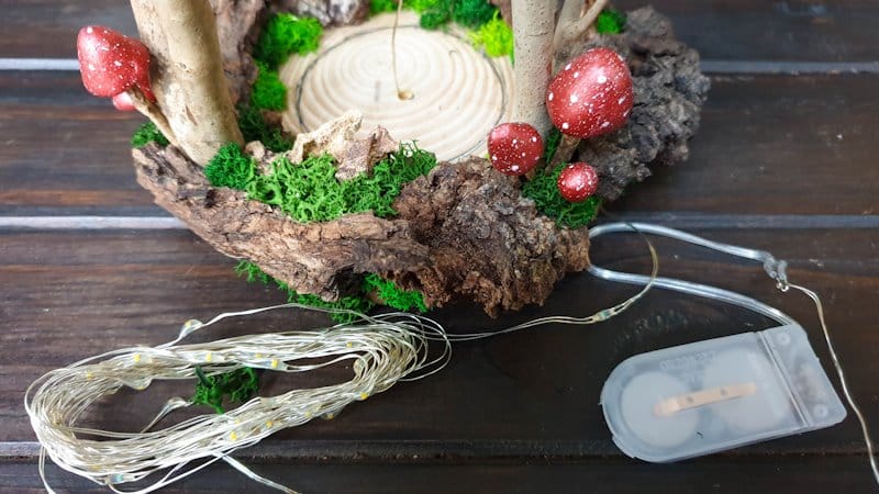 Thread the fairy lights up through the hole