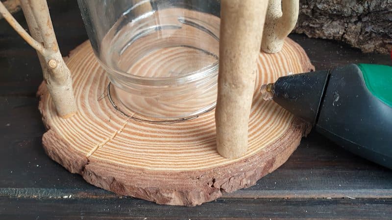 A view of the DIY fairy lantern after gluing on the twig supports