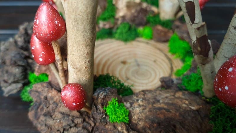 Add small clay mushrooms in amongst the bark chips