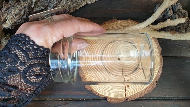 Use the glass jar as a guide to cut the twigs to the right height