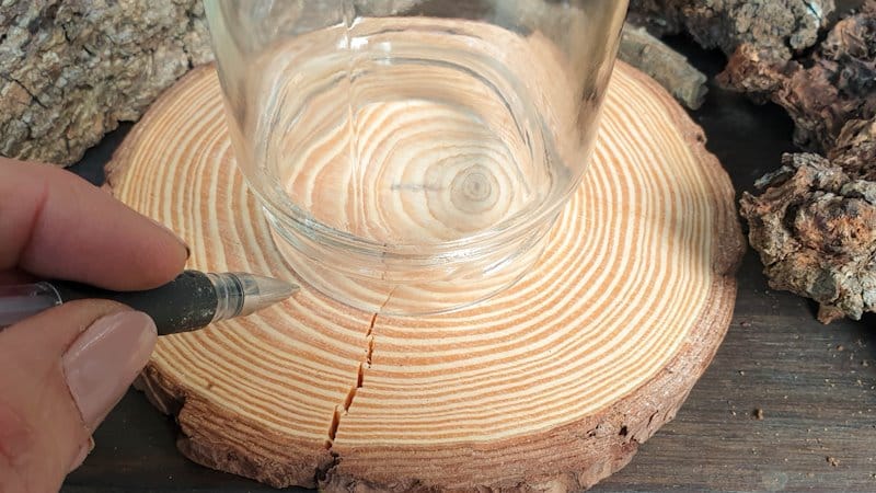 Trace around the neck of the bottle to get a sense of where to add your foraged finds