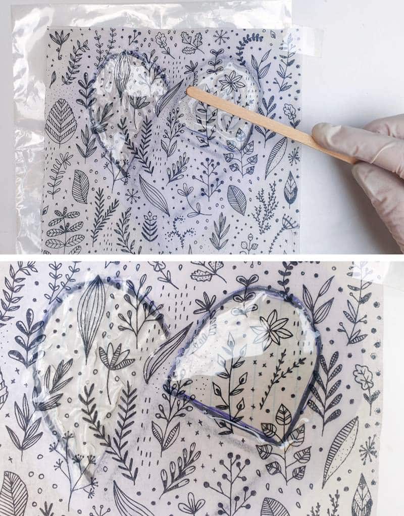 Add the resin over the napkin. Use a craft stick to spread the resin,