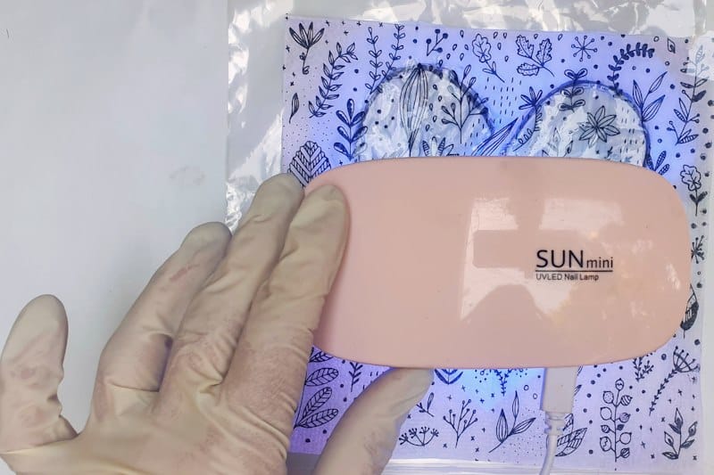 Cure the resin under a UV light for the recommended time