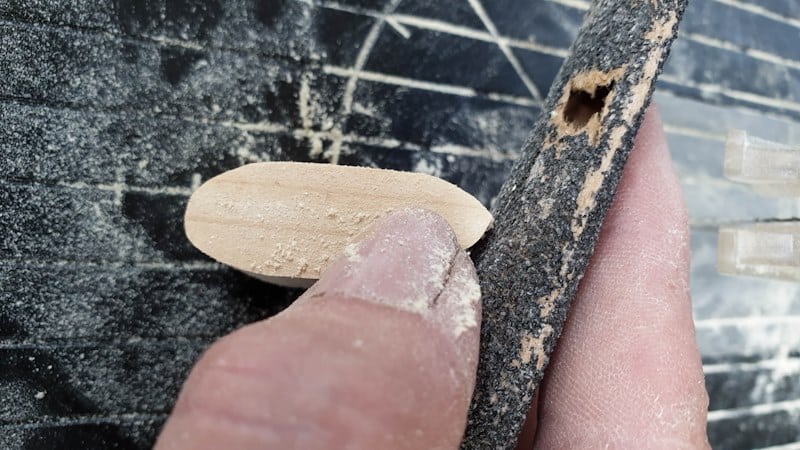 Sand the fingers after cutting