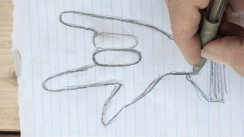 Transfer the "I Love You" hand sign image to a piece of wood