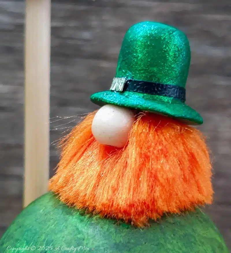 Have we got a fun, festive craft idea to bring a touch of Irish charm to our decor! I’ll show you how to make these place cardholders with tiny leprechauns, a polystyrene ball mushroom, and a signpost. Not only will these adorable little accents add a pop of color to your table, but they're super simple to make too.Have we got a fun, festive craft idea to bring a touch of Irish charm to our decor! I’ll show you how to make these St. Patrick's Day place cardholders with little leprechauns, a polystyrene ball mushroom, and a signpost. Not only will these adorable little accents add a pop of color to your table, but they're super simple to make too.