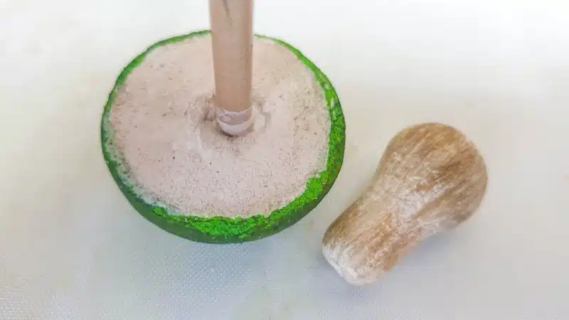 Make a dent in the mushroom top for the stalk