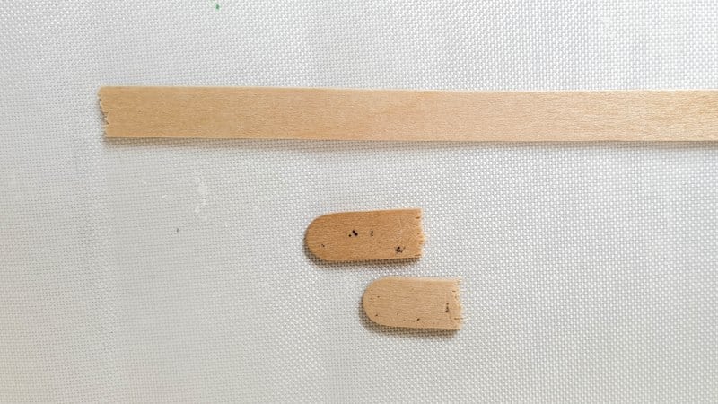 Snap the edges off of the craft sticks