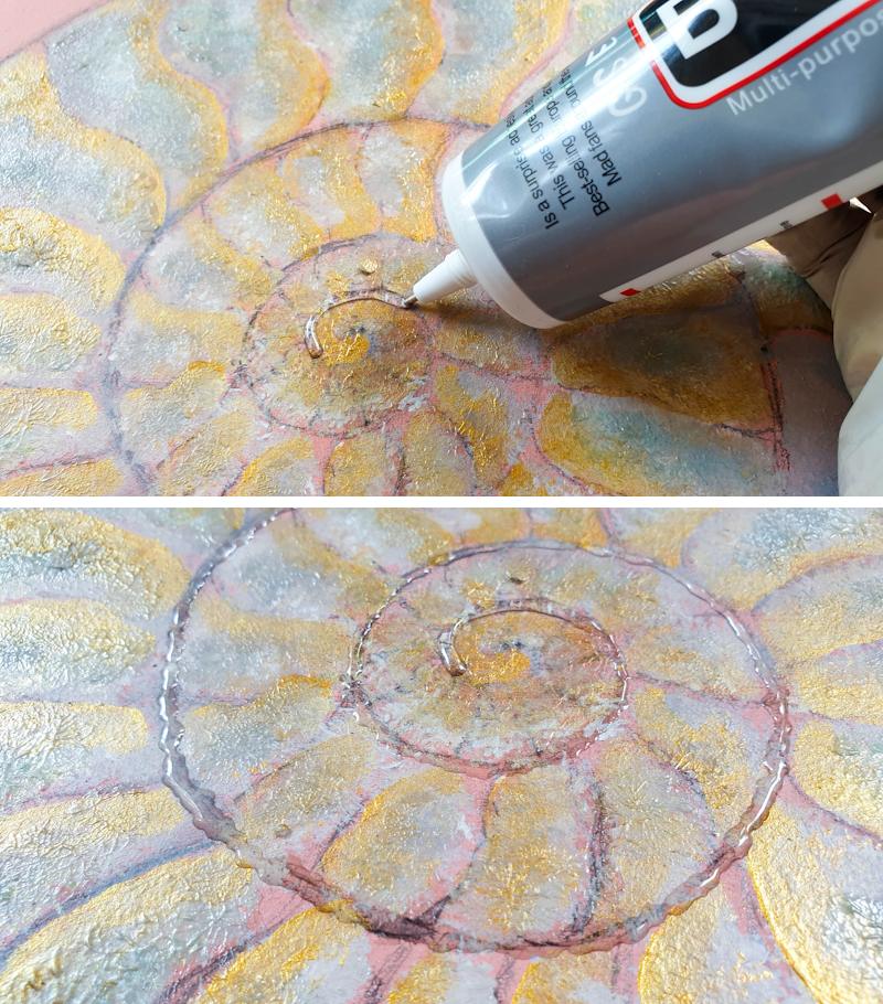 Apply B7000 glue to the ammonite and glue on the cardboard strips