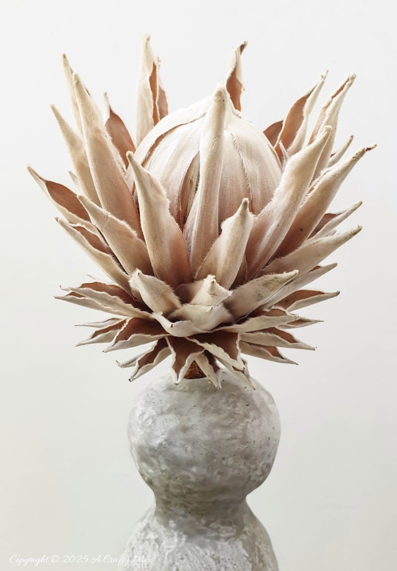 Make a delightful faux concrete bunny vase in under an hour using stuff you probably have lying around. This easy Easter craft is perfect for adding a touch of rustic elegance to your home decor. Use it to display long leaves for bunny ears or fill it with flowers for a beautiful centerpiece. It's a fun and creative way to welcome spring.